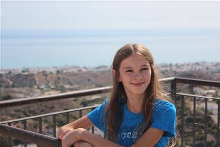 My daughter and the view from the Mirador del Castillo, the highest point of Mojacar.
