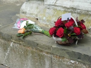 The basket of roses and other flowers waiting outside the chapel to be laid on Anne's tile. c. Paudie Kennelly