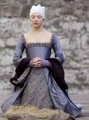 Natalie Dormer as Anne Boleyn kneeling on the scaffold at her execution