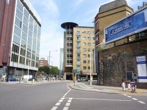 © Marilyn Roberts Mansell Street, London EC3. The Abbey of the Minoresses lay on the left of the picture, where the trees are now and covered about 2½ acres. The sisters also had a farm, which lay behind the buildings centre and right of the photograph. In Victorian times the coming of the railways swept through the area. The railway arches (right) swung round at this point towards a large goods depot where the trees are now, so it is remarkable that Anne Mowbray’s coffin survived.