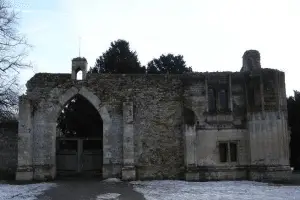 Ramsey Abbey, carved gatehouse with ornate oriel window, 15th century.