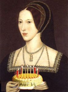 Anne Boleyn holding a birthday cake for the Anne Boleyn Files 14th birthday